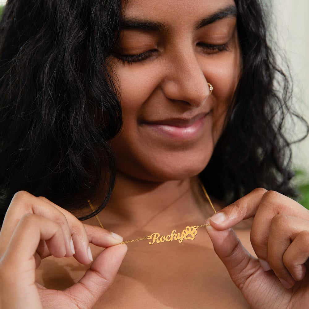Woman wearing personalized dog remembrance necklace – pet loss jewelry to keep your dog’s memory close